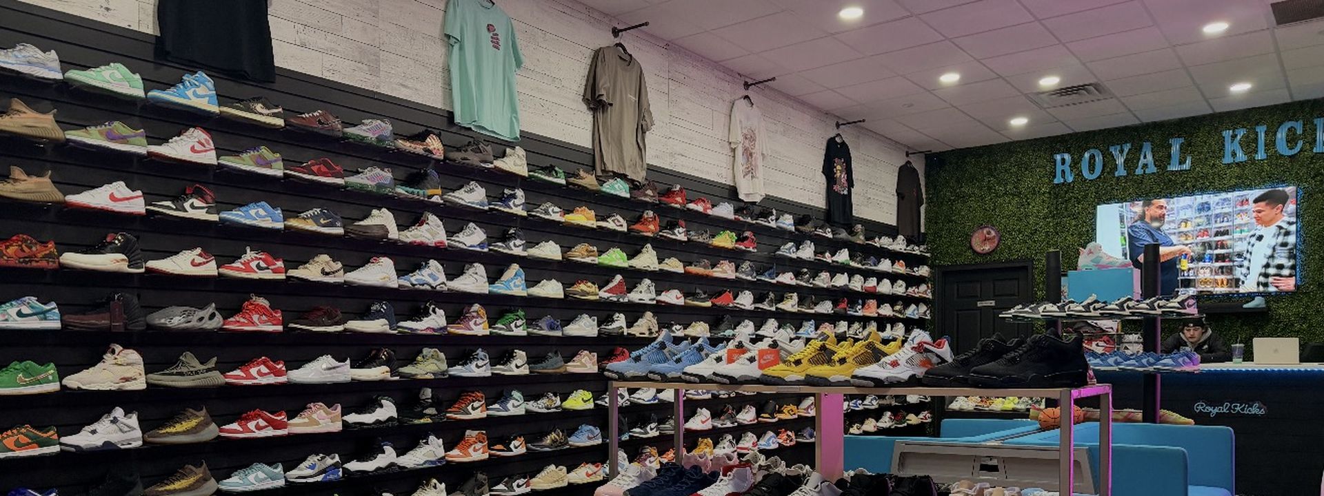 Inside Royal Kicks LLC store at Battle Creek MI 49017 &mdash; walls lined with sneakers